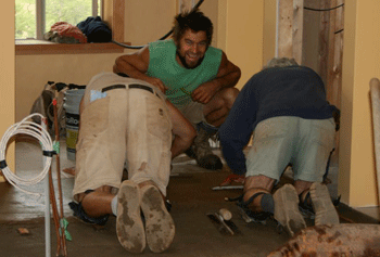 Mike, Silas and Terry hammingit up with trowelling the final coat on the floor