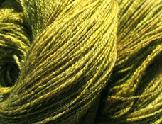 Hand spun yarn in a blend of merino and silk.