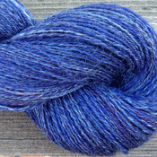 Hand spun yarn in a blend of merino, mohair, angora and silk.