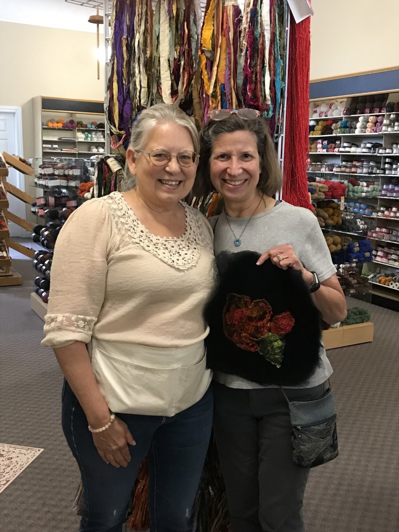 Fiber Art Shoppe owner Sherri Duey (left) and Treenway Silks' Susan Du Bois (right).  We are standing in front of Sari Ribbons (from Treenway Silks)