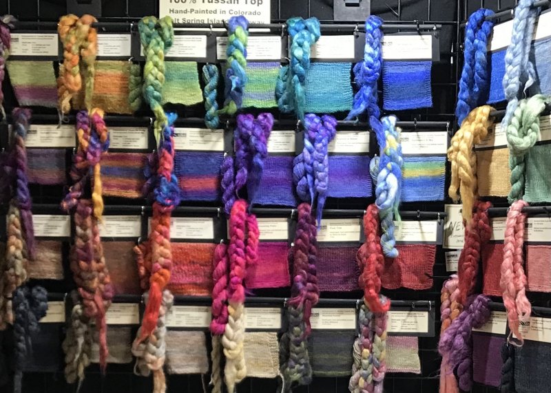 A1 Grade Tussah in Salt Spring Island colorways with hand-spun samples and knitted swatches, on display at SOAR 2021
