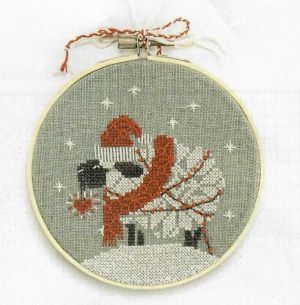 'Snowflake Sheep' ornament by Counting Puddles' Lindsey Whitney, featured in Just CrossStitch 2023 Christmas Ornament issue.